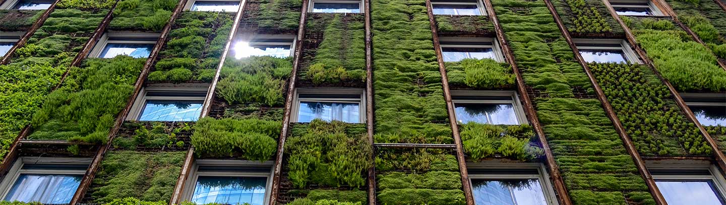 High rise building with plants on building